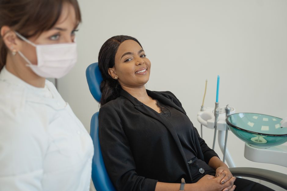 confident patient smiling with a single tooth dental implant