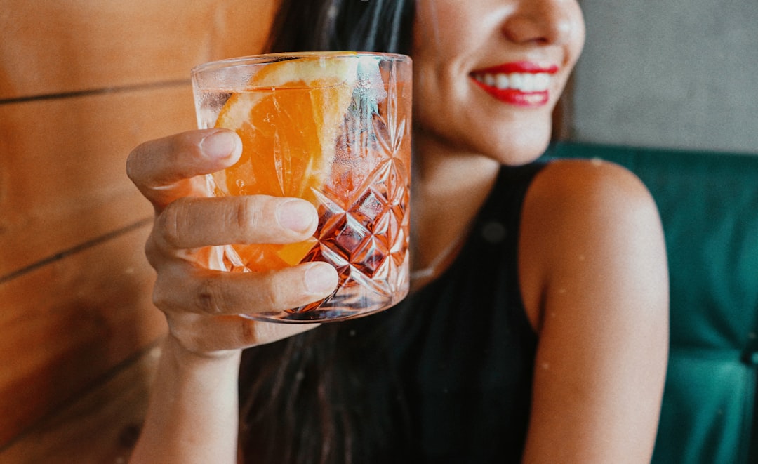 person enjoying a drink experiencing dry mouth symptoms